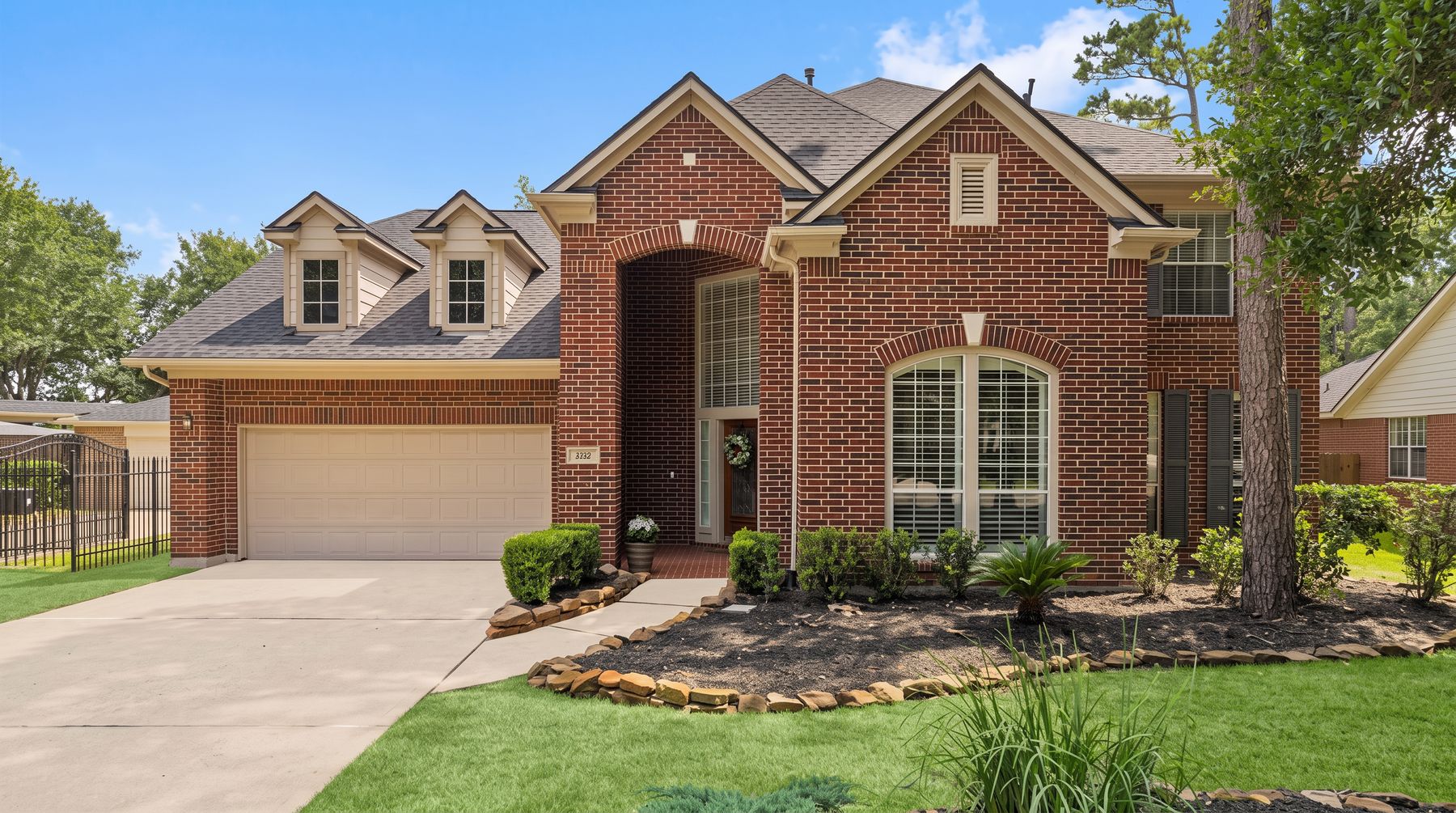 The two-story brick front of the house